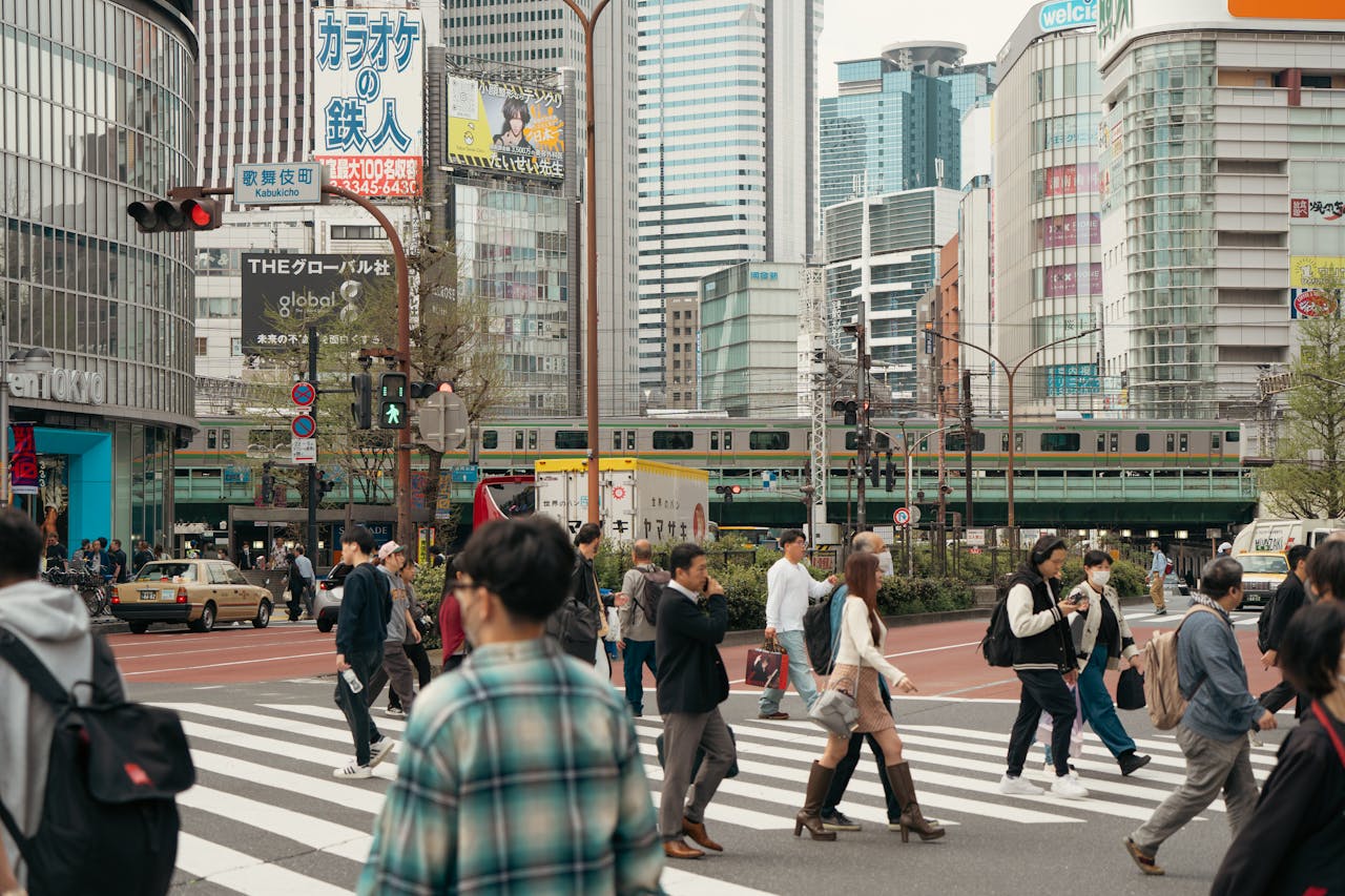 stats-img People crossing at Shibuya, Tokyo showcasing urban life and vibrant cityscape.
